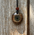 Bali Coin Tensioning Pendant gold mandala coin green stone copper border dark matrix rudraksha bead black cord orgonite sacred Balinese stones Batuan Bali