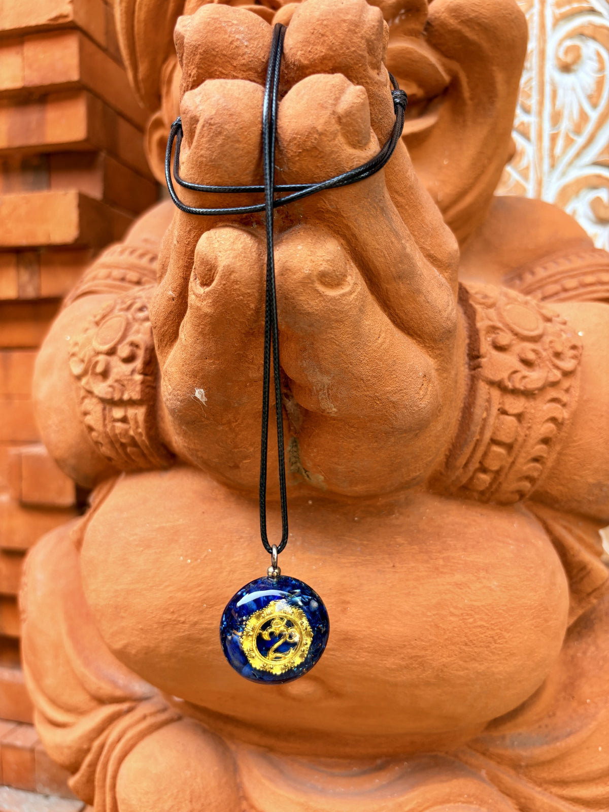 Bali Umkara Small Pendant lapis lazuli gold Om symbol black cord orgonite royal blue matrix Ganesha anjali mudra Batuan Bali