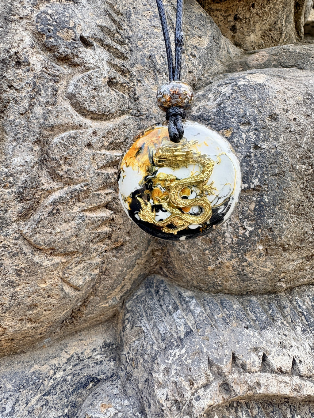 Glory Dragon Prosperity Pendant front black white amber swirling resin large gold dragon charm orgonite matrix bail bead black cord