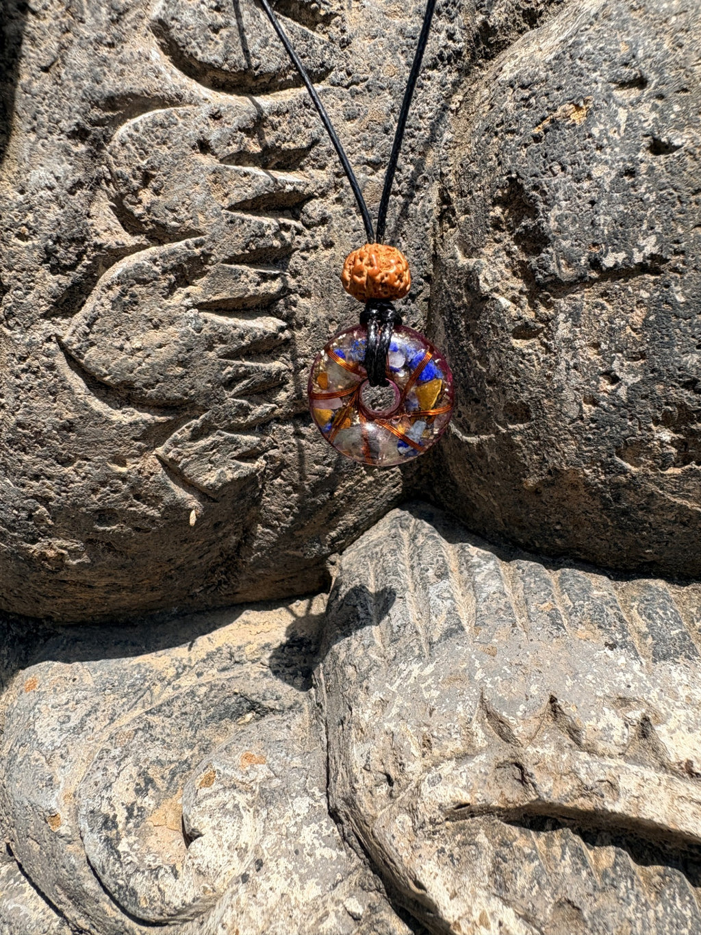 Mini 7 Chakra Torus Pendant front view multicolour chakra stones copper wire winding Rudraksha bead 23mm black cord Balinese stone Batuan Bali