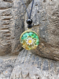 Mini Daisy Pendant with Yellow Brass front teal green gold two-tone orgonite matrix Aventurine Citrine Tiger Eye Carnelian white enamel daisy gold leaf yellow brass border ring black onyx bail bead Batuan Bali