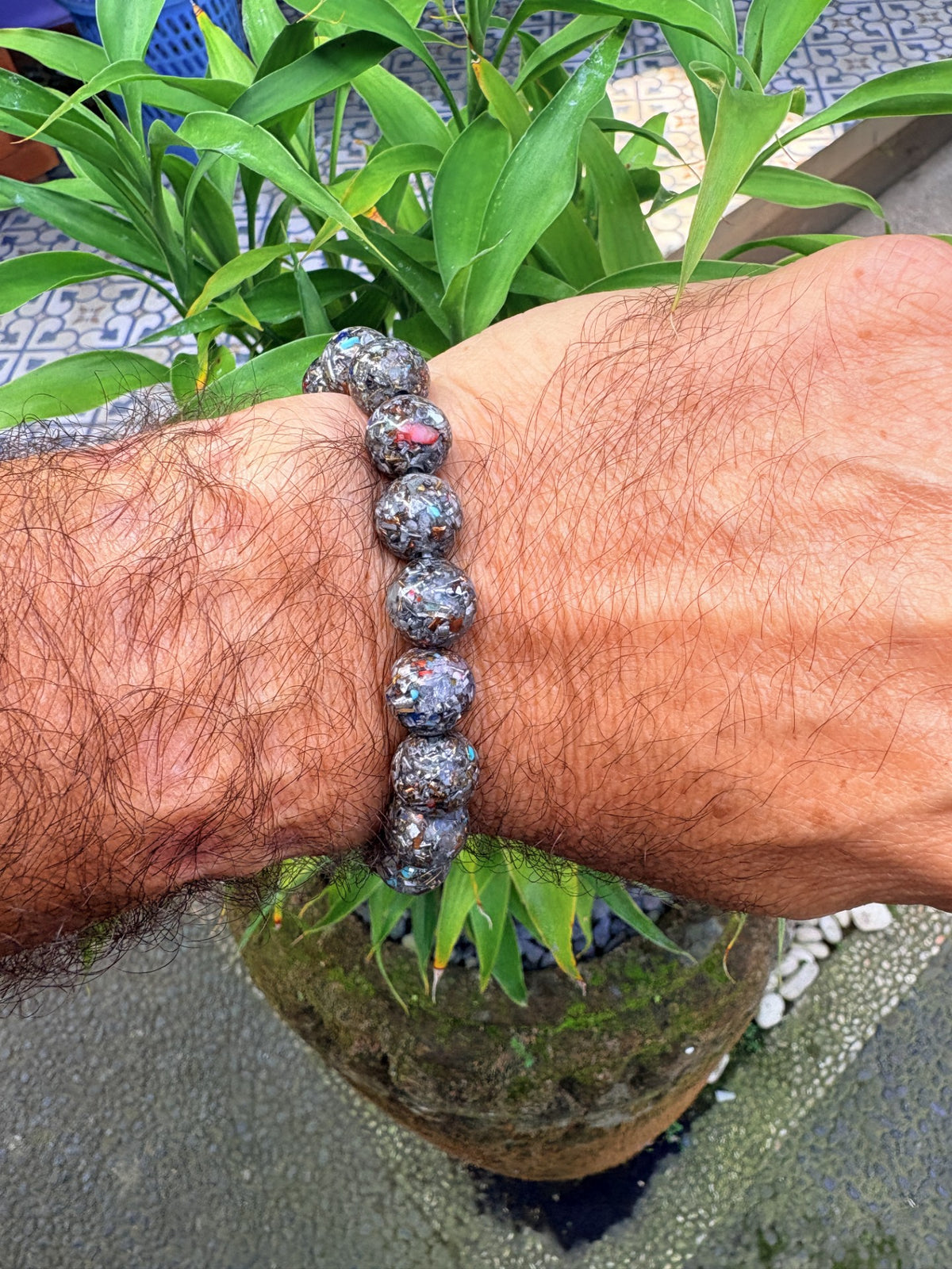 Seven Chakra Orgonite Bracelet 15 large mixed stone orgonite sphere beads elastic cord worn on male wrist 55mm internal diameter Batuan Bali