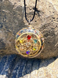 Seed of Life Chakra Pendant seven chakra stones gold sacred geometry mandala orgonite clear resin black cord Batuan Bali